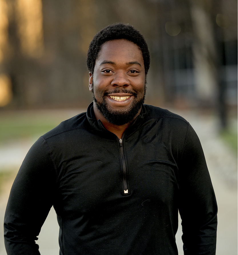 vertical shot attractive african american male smiling camera 1 1
